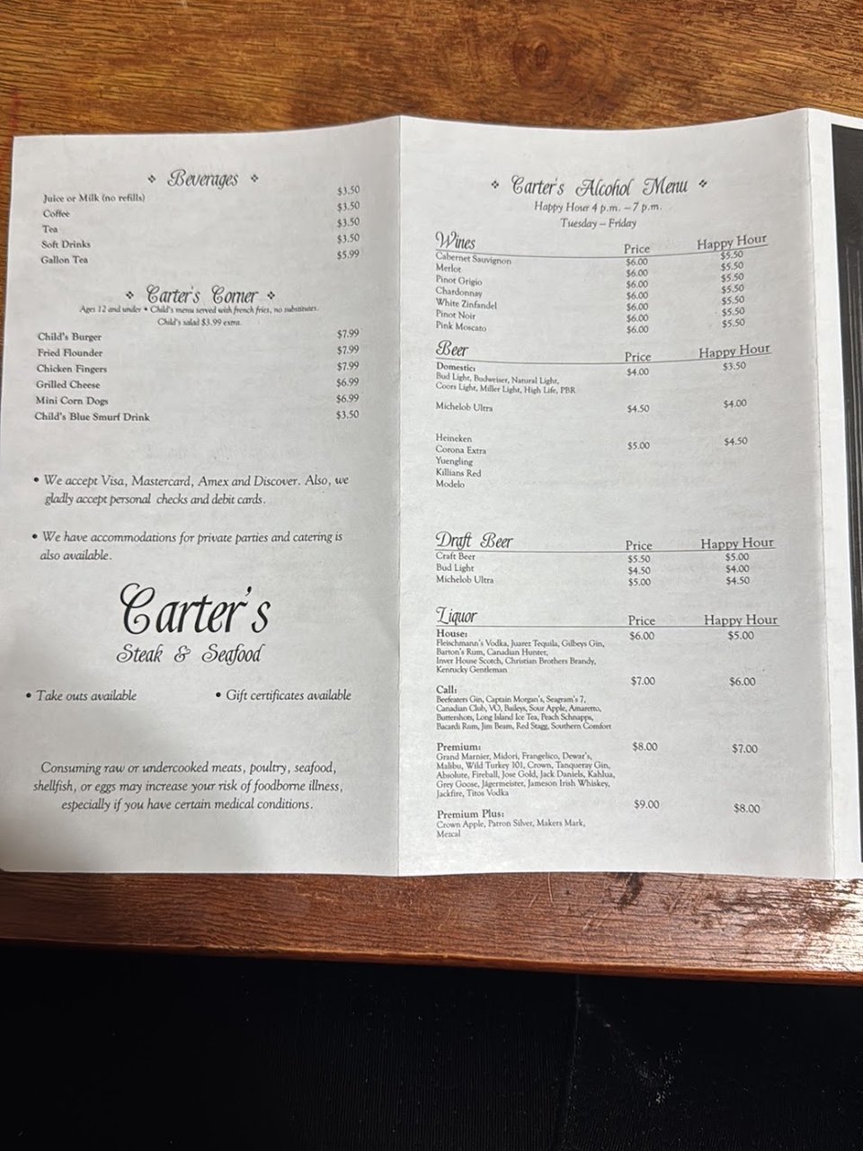 Printed menu with steak and seafood dishes